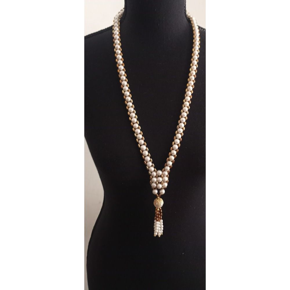 Faux pearl and gold necklace. Approximately 15 inches long.
